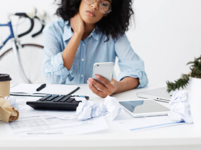 Woman doing her taxes and considering tax strategies for her estate plan