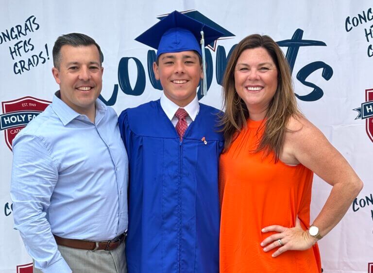 Son with parents celebrating graduation