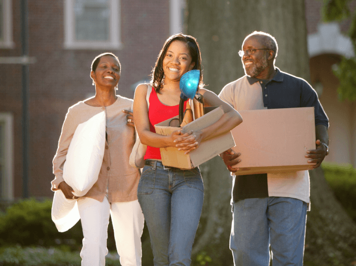 Parents dropping young adult off at college