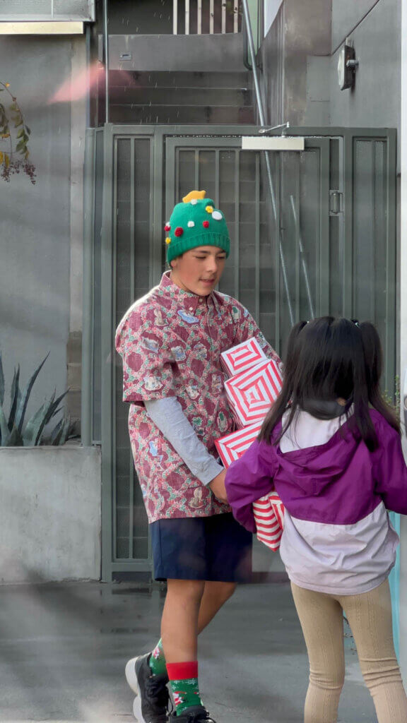 kids carrying gift for charity