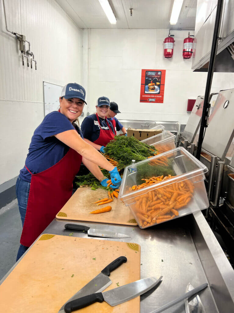 cleaning carrots at charity