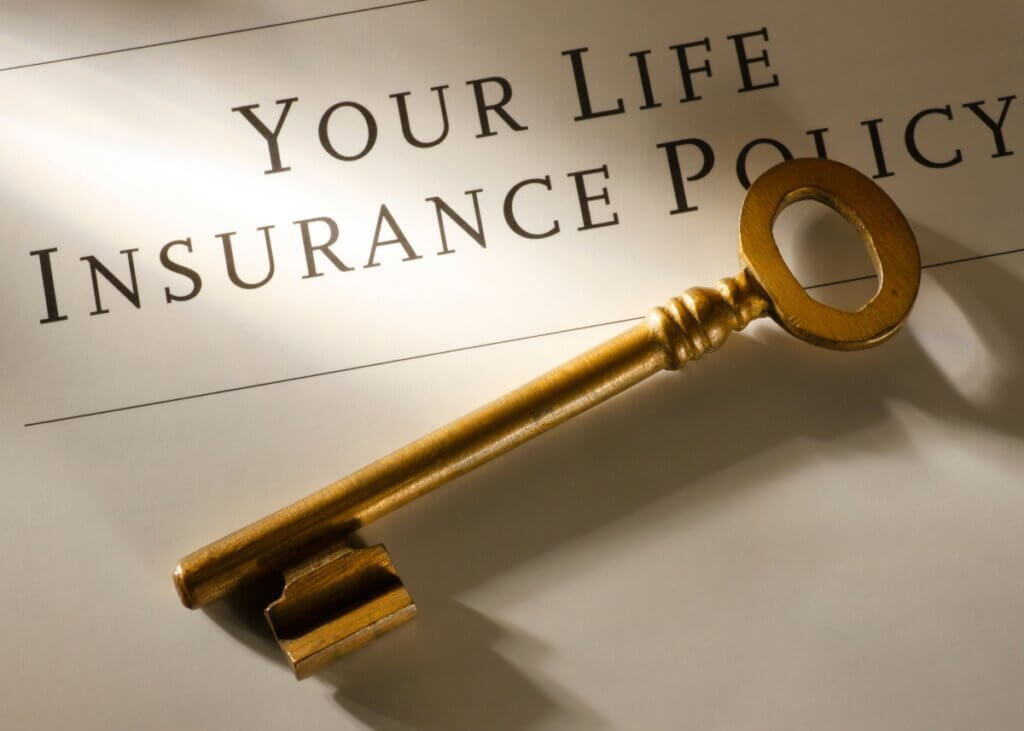 an image with a key on a document that says your life insurance policy